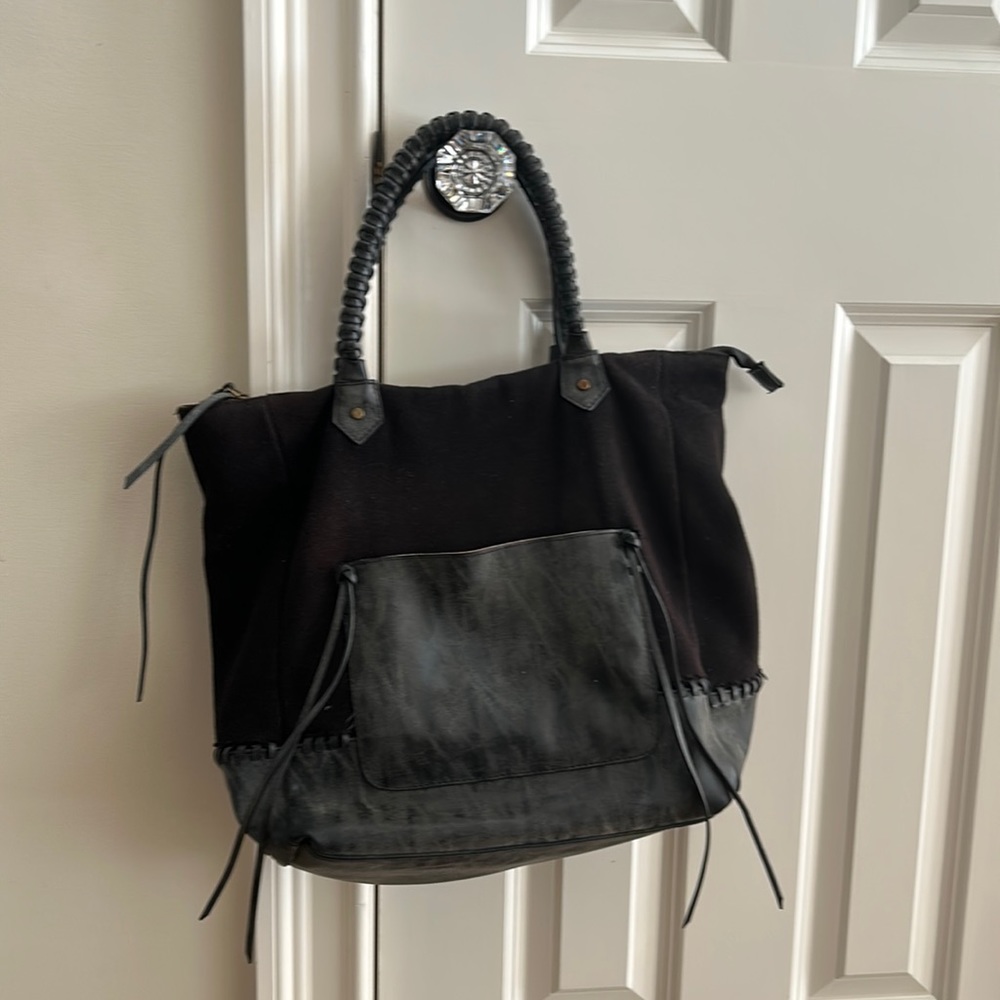 Elle & Joie Black mixed material black shoulder bag woth fringes. Zips closed.